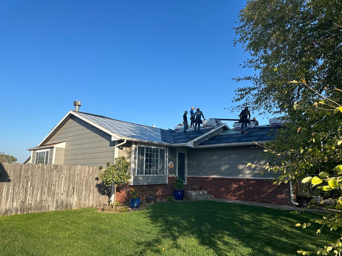 A JAKS crew replacing a storm damaged roof on a Wichita area home
