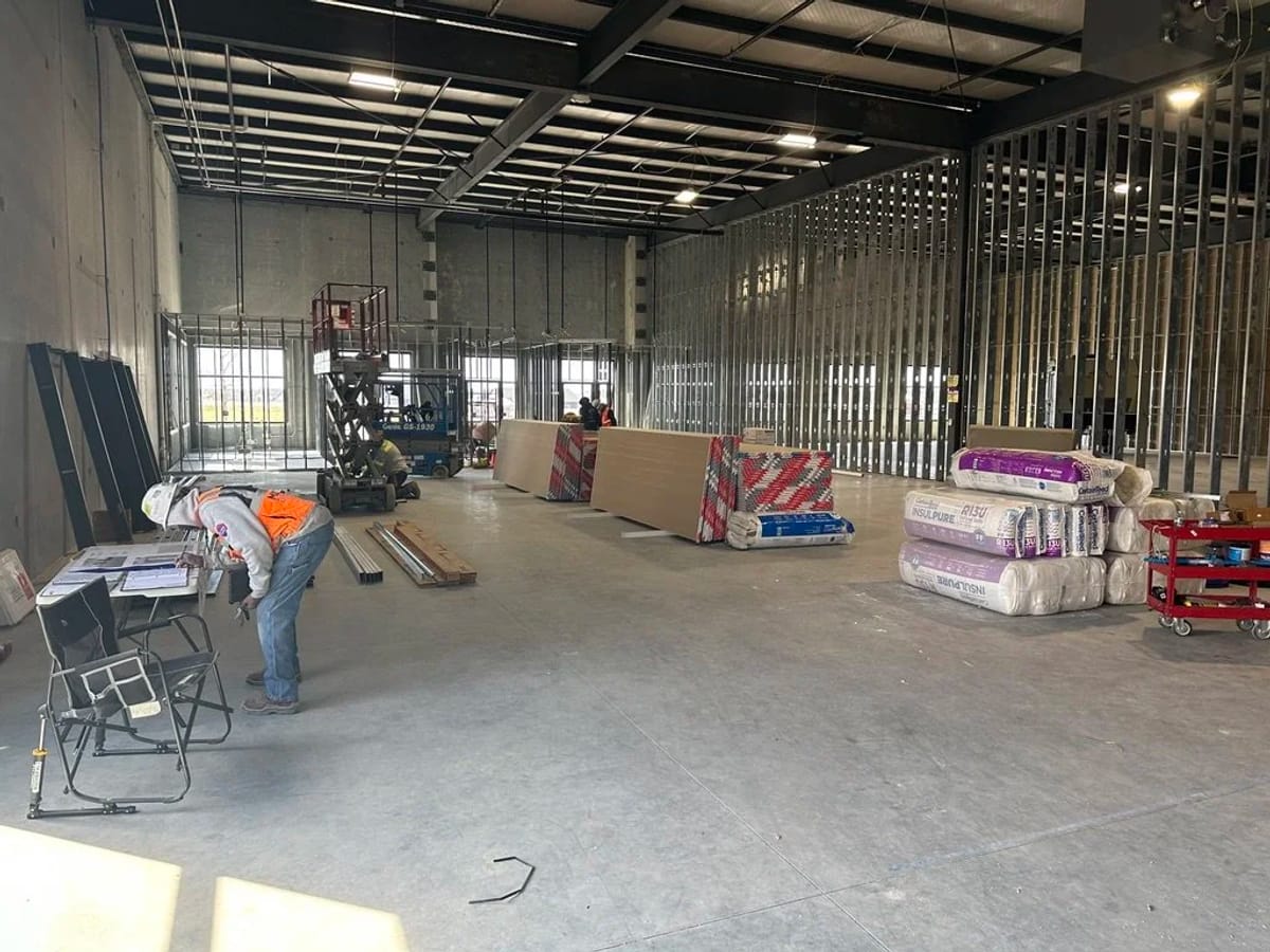 Light-gauge steel framing during the JAKS Construction buildout for Walk Your Plans Wichita