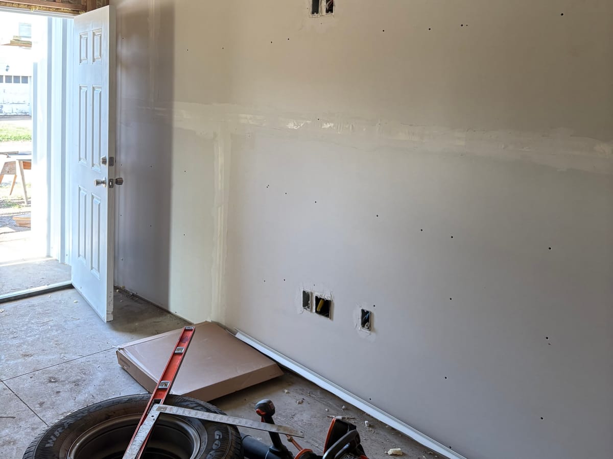 Interior drywall finishing inside a unit of the JAKS six-plex build in Wellington, Kansas